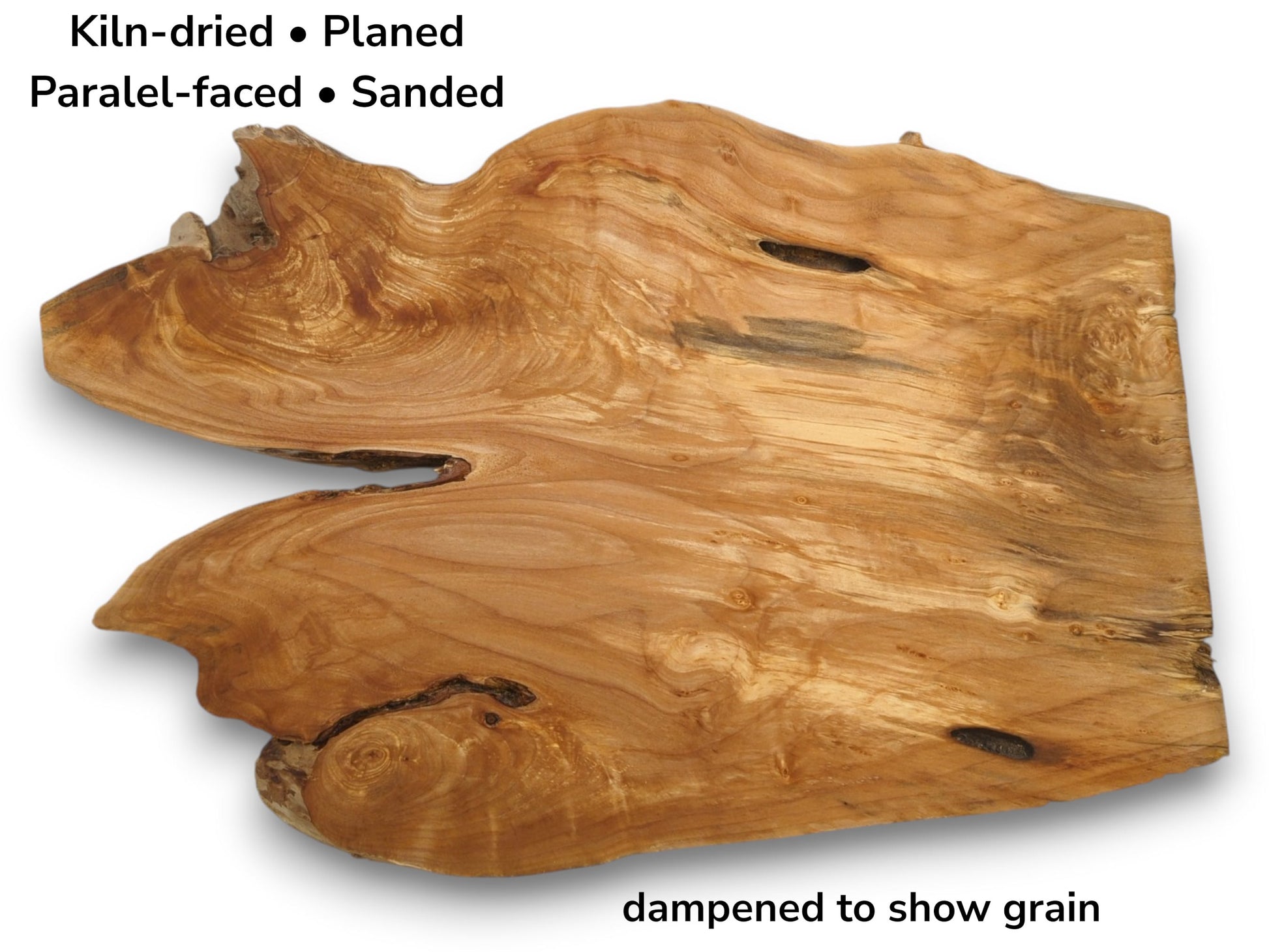 Overhead view of a lustrous alder root slab with a deep side cleft and voids.