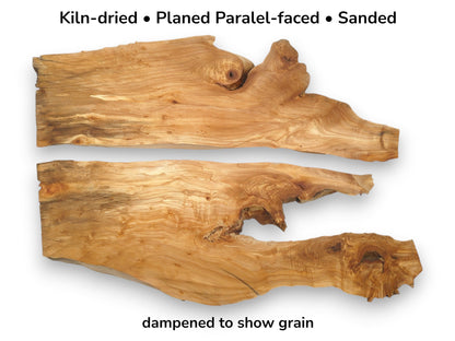 Two gnarled timber sections with live edges display swirling grain patterns and prominent burls.
