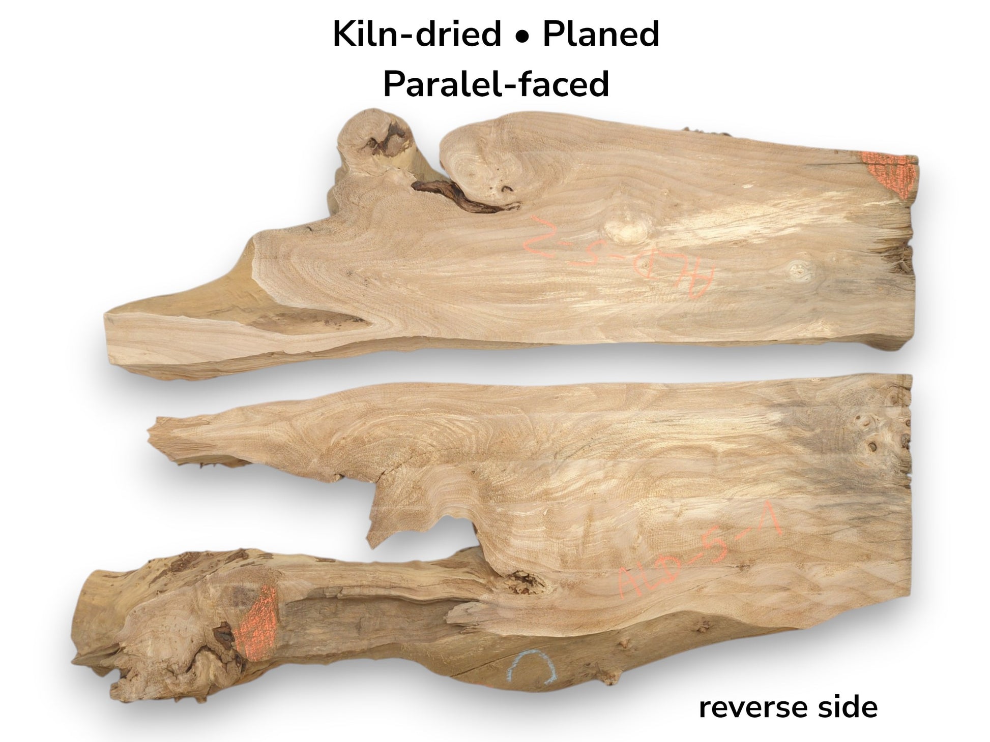 Two smooth, planed lumber sections with irregular, knotty perimeters reveal their gently rippling grain.