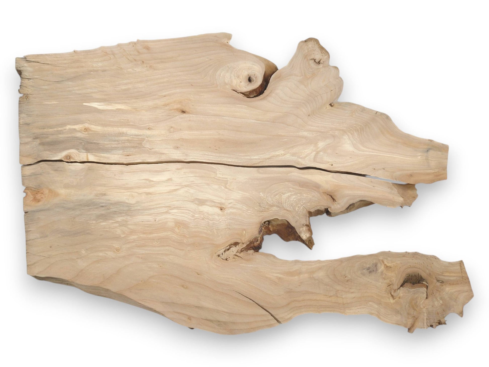 A light-toned wood slab with organic edges is bisected by a dark, horizontal crack.