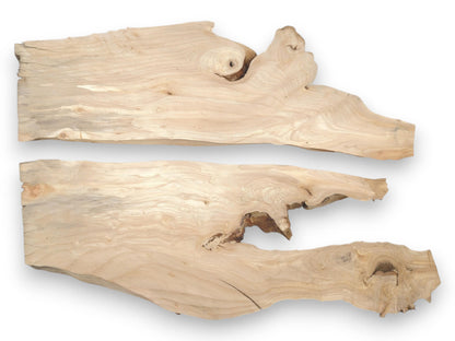 Two pale timber planks lie horizontally, showing swirling grain patterns and irregular, knotted edges.
