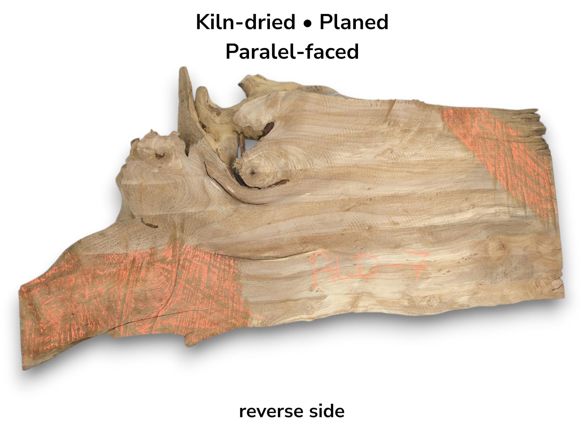 The reverse of a planed timber slab featuring a complex, knotted edge and orange marks.