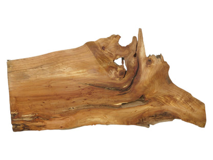 Warm-toned lumber with swirling grain culminates in a rugged, sculptural live edge with voids.