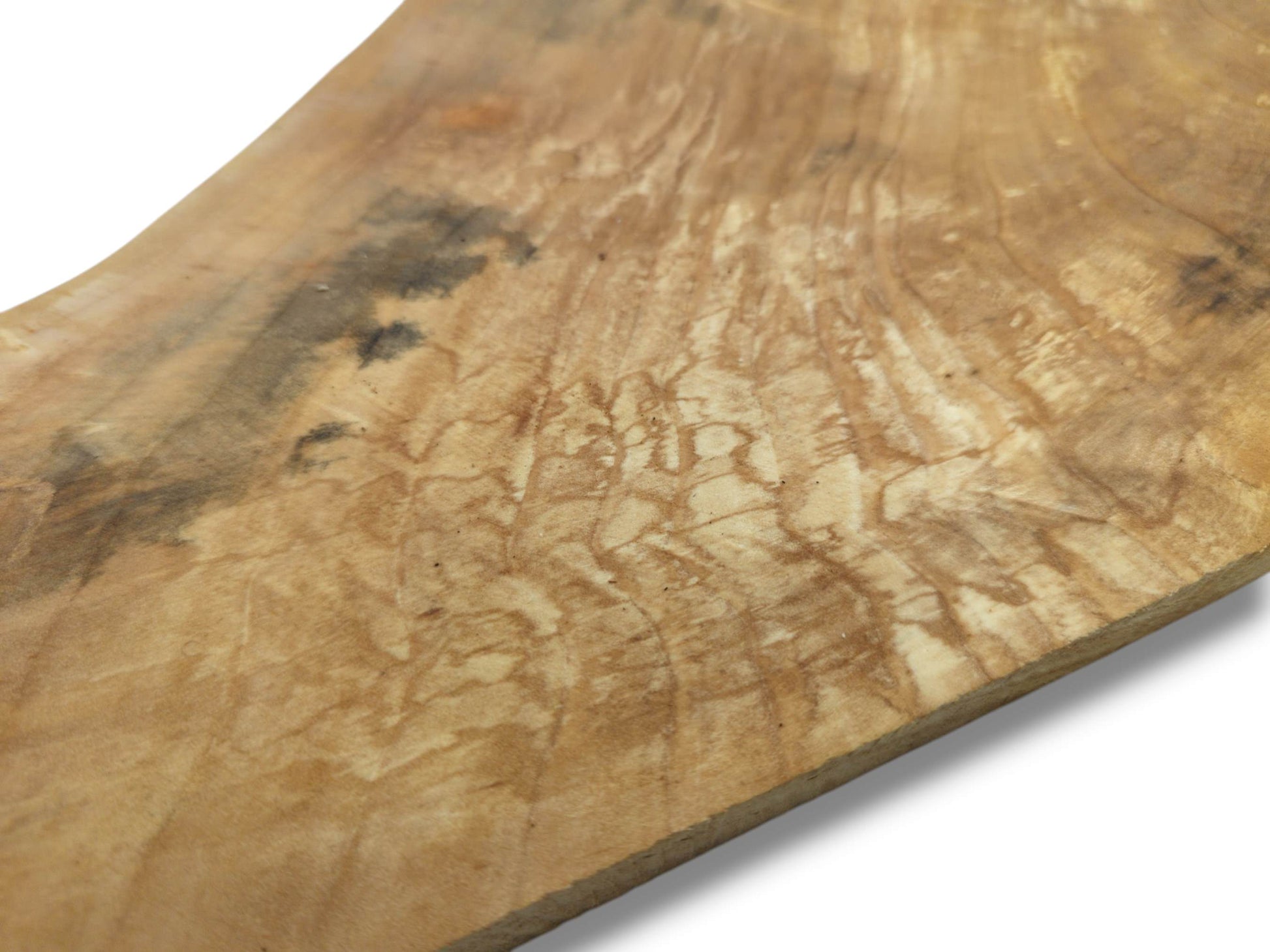 A pale timber slab shows intricate, spalted figuring and dark, shadowy mineral stains.