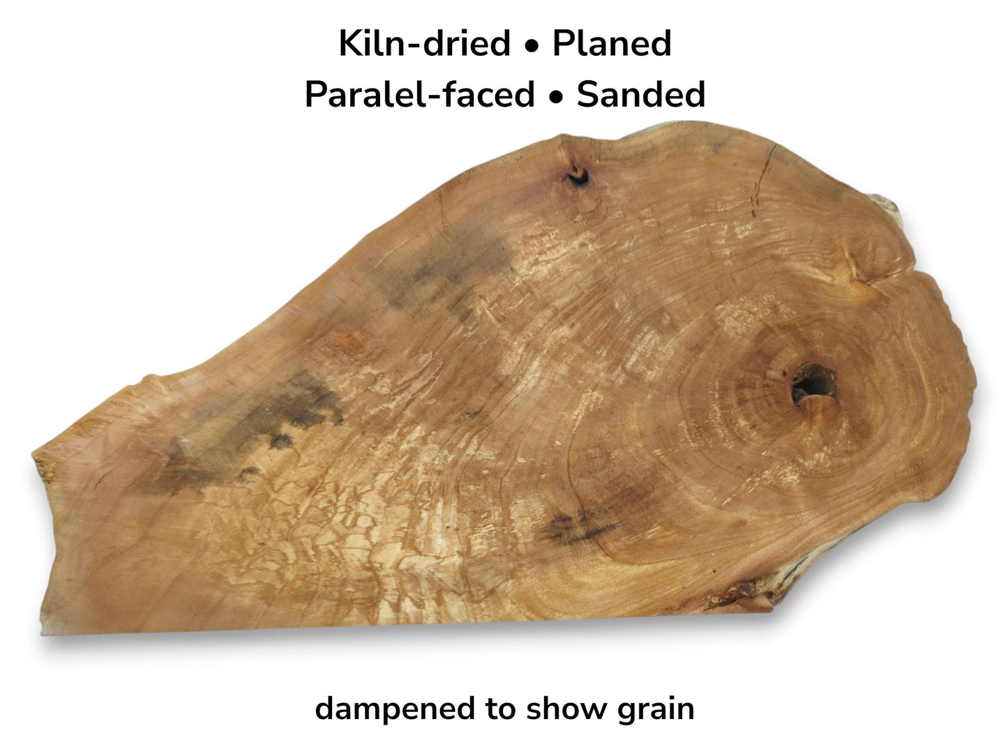 A planed alder root slab shows marbled grain, swirling rings, and a dark knot.