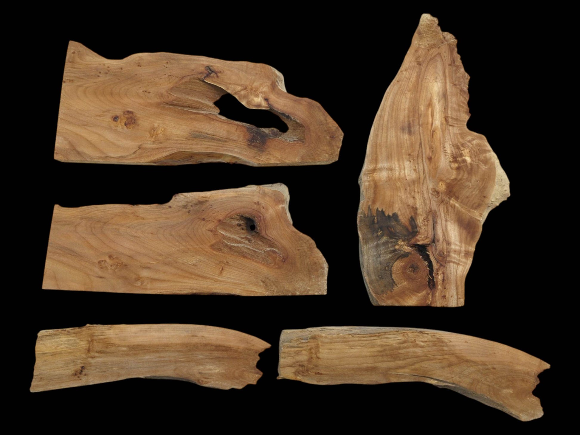 Five natural alder wood pieces with unique shapes, visible grain, and some dark knots.
