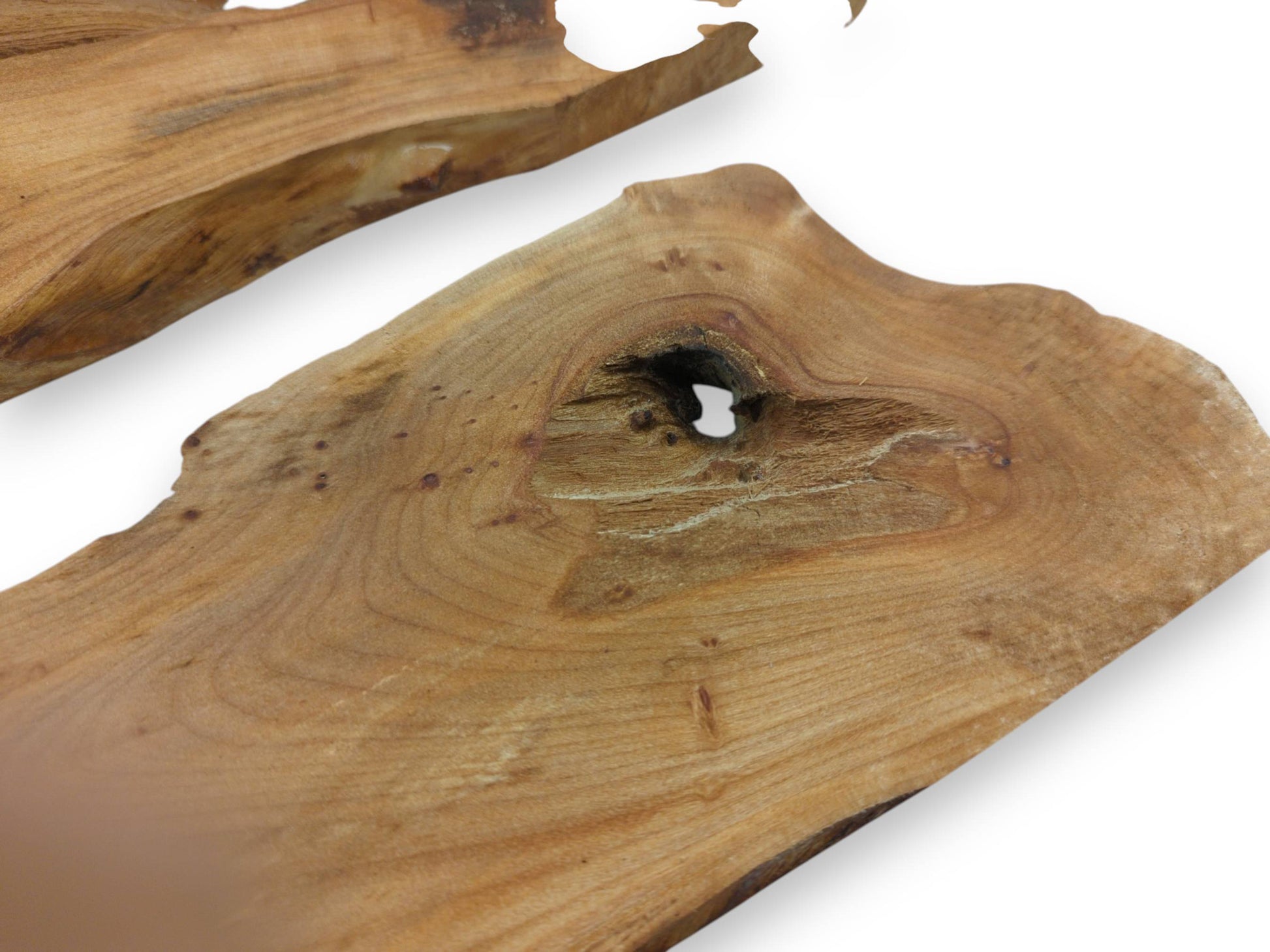 Two light brown alder wood slabs with natural edges and a prominent knot hole.
