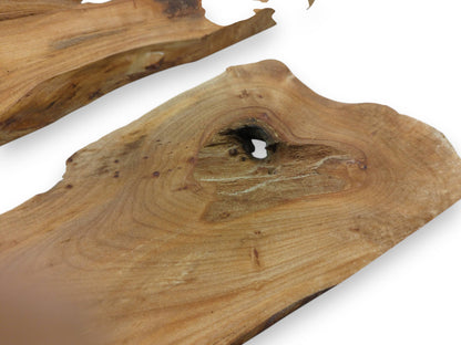 Two light brown alder wood slabs with natural edges and a prominent knot hole.