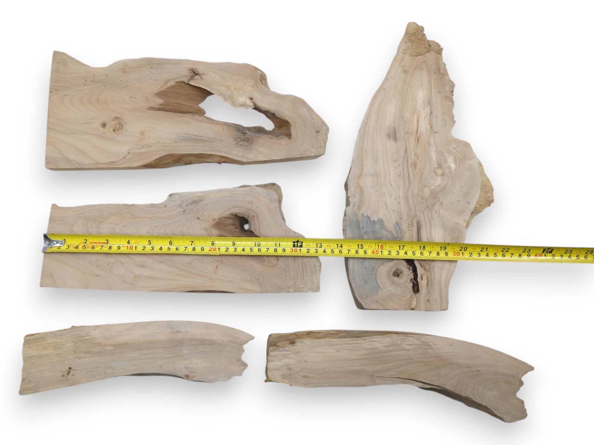 Five natural alder wood slabs with live edges, prominent knots, and varied wood grain.