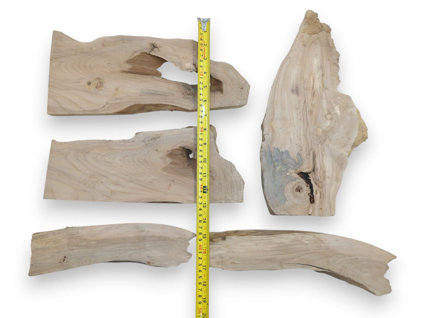 Five natural alder wood slabs with live edges, prominent knots, and varied wood grain.