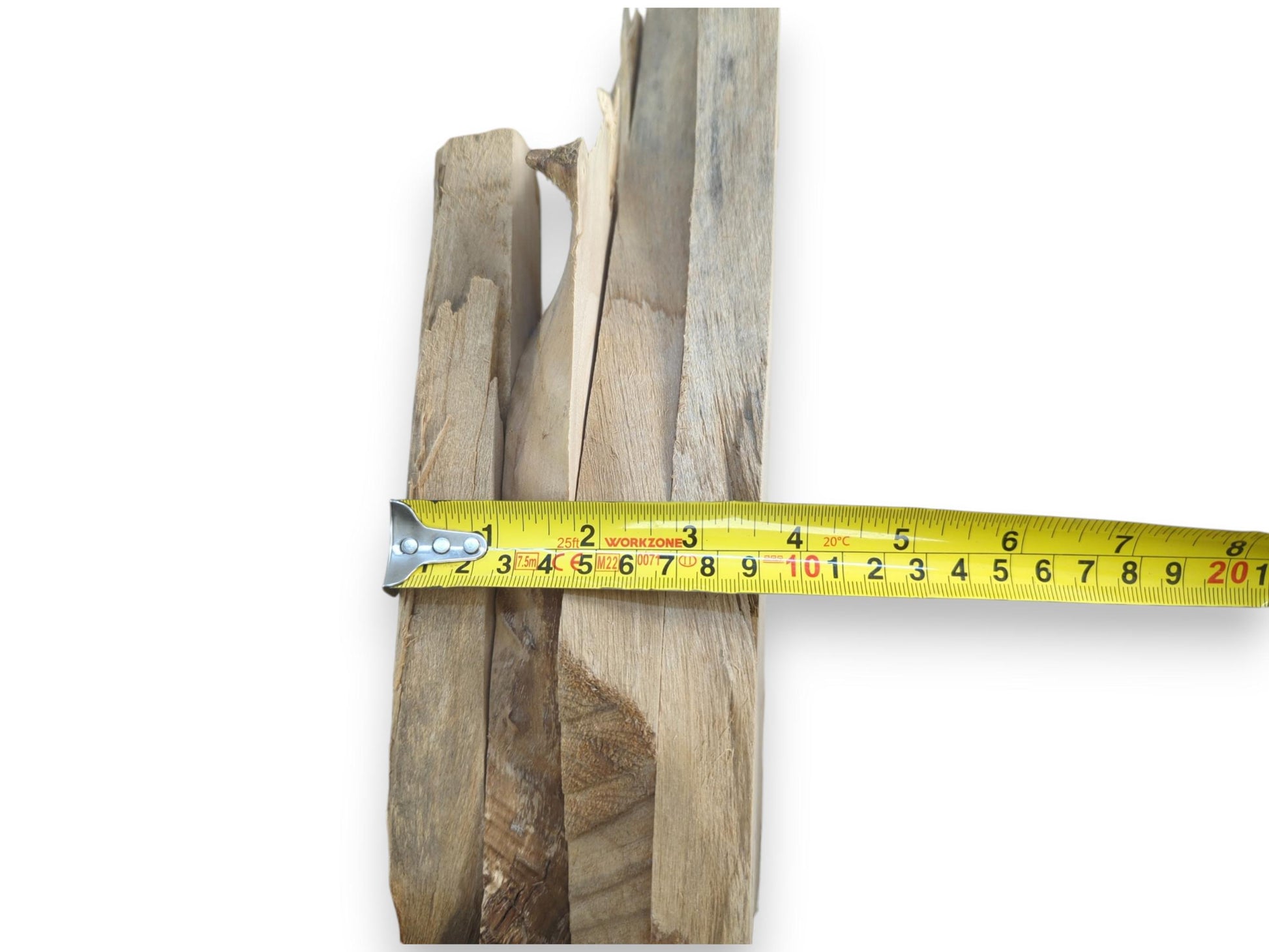 A stack of natural alder wood pieces with a measuring tape across them.