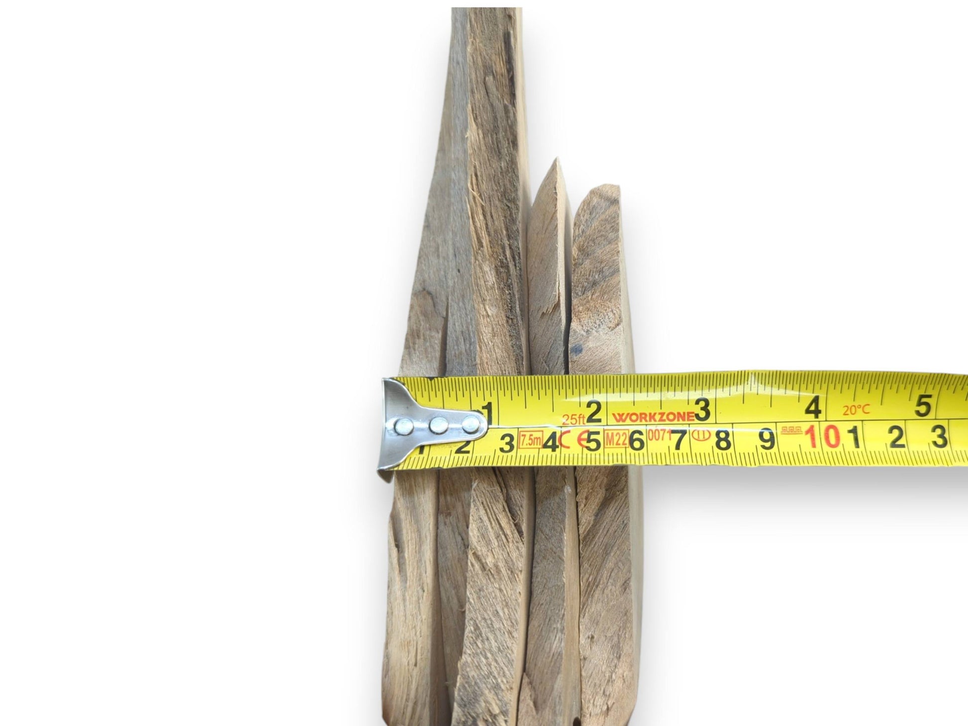 A stack of natural alder wood pieces with varying lengths and visible grain patterns.