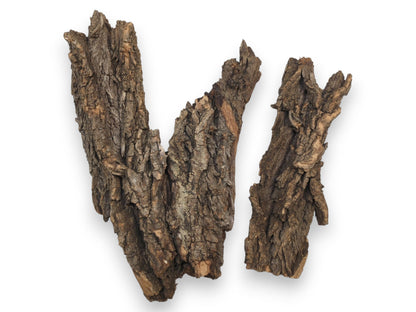 Two separate pieces of natural tree bark showing their rough, deeply fissured textures and jagged edges.