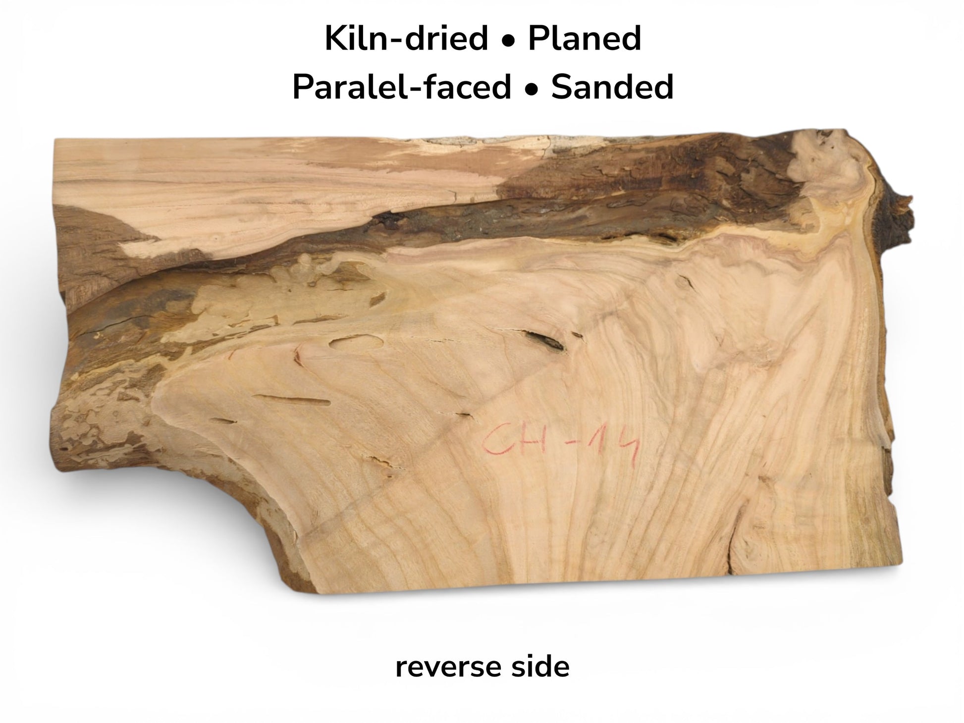The reverse side of a cherry wood blank, showing its light-toned grain, dark edge, and preparation text.