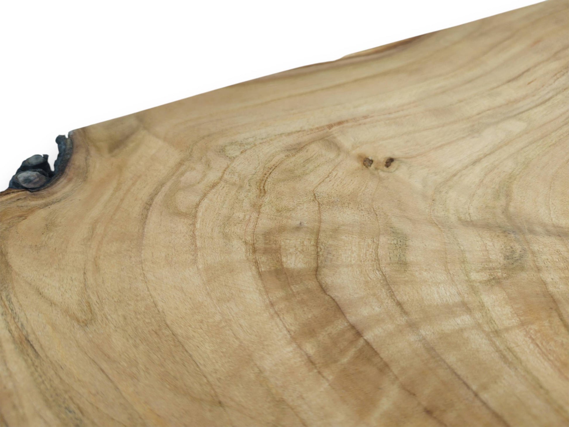 A focused close-up on a wild cherry slab, showing the wavy wood grain and dark burl.