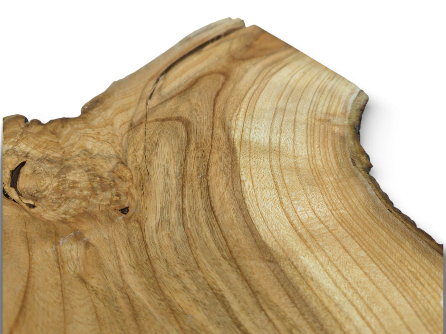 Angled perspective on a cherry slab's corner, detailing a prominent burl and finely curved grain lines.