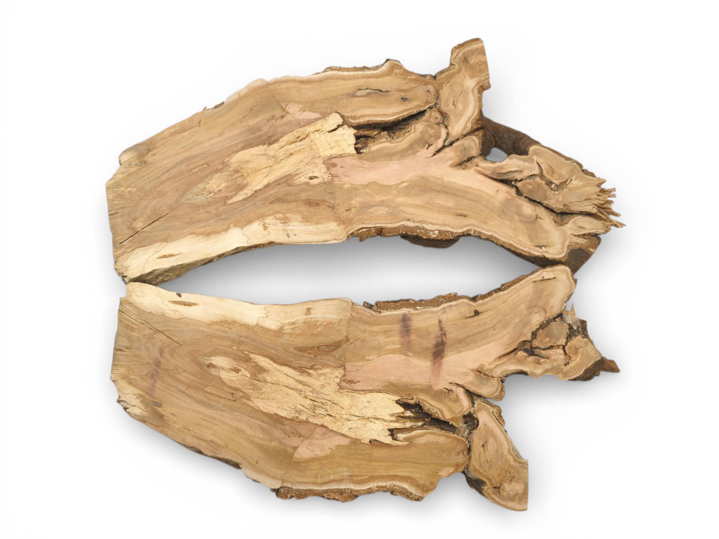 Two corresponding halves of a raw cherry slab display their irregular live edges and varied grain.