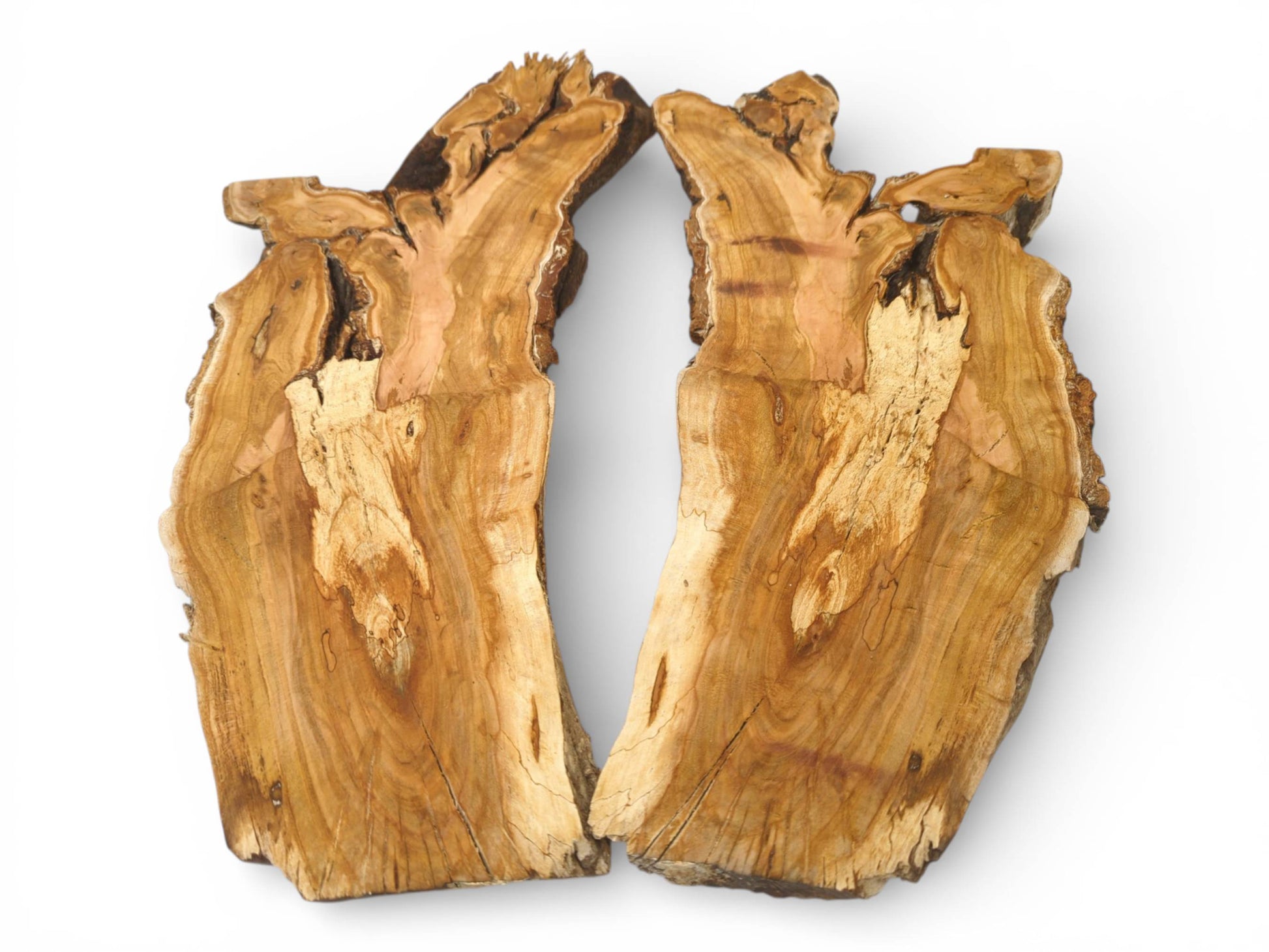 An overhead perspective of a single wood slab split into two halves, revealing intricate grain.