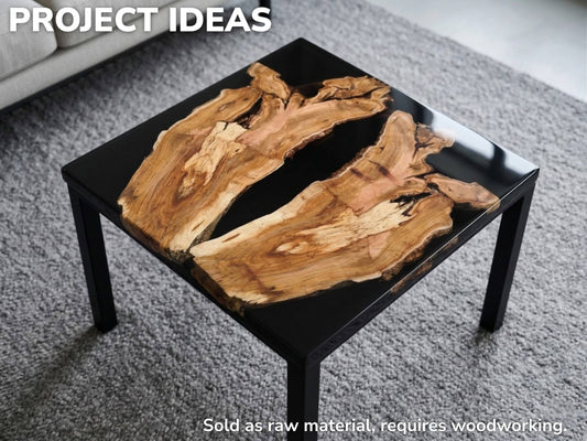 A completed project example showing a square coffee table made with wood slabs and black epoxy.