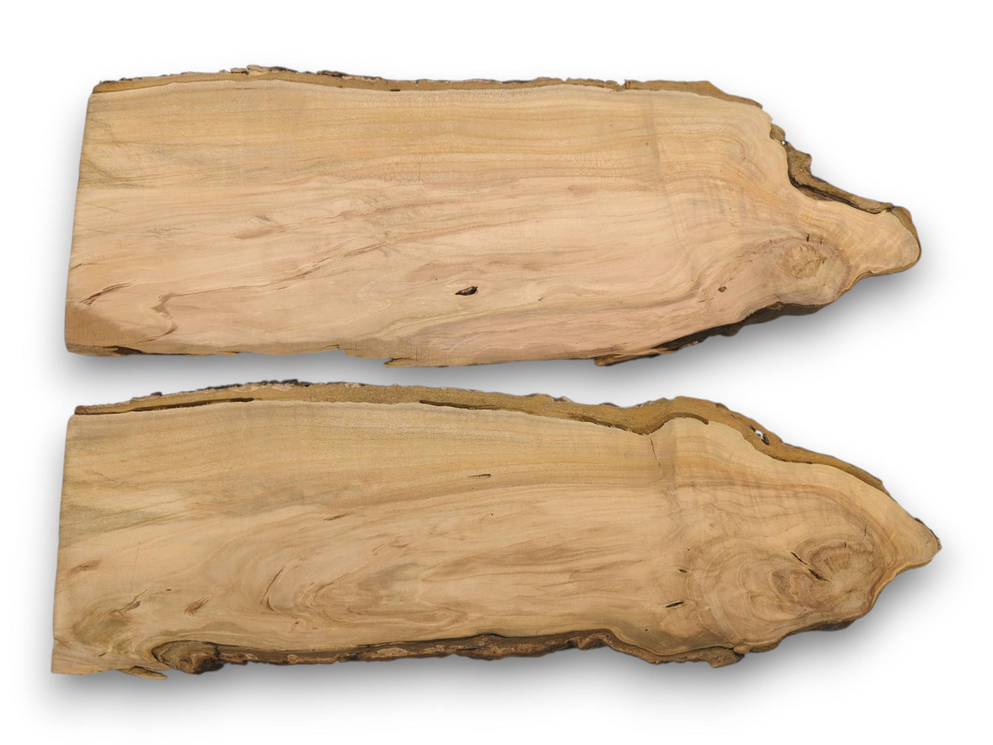 A direct overhead view of two wild cherry slabs, showing their natural live edges and grain.