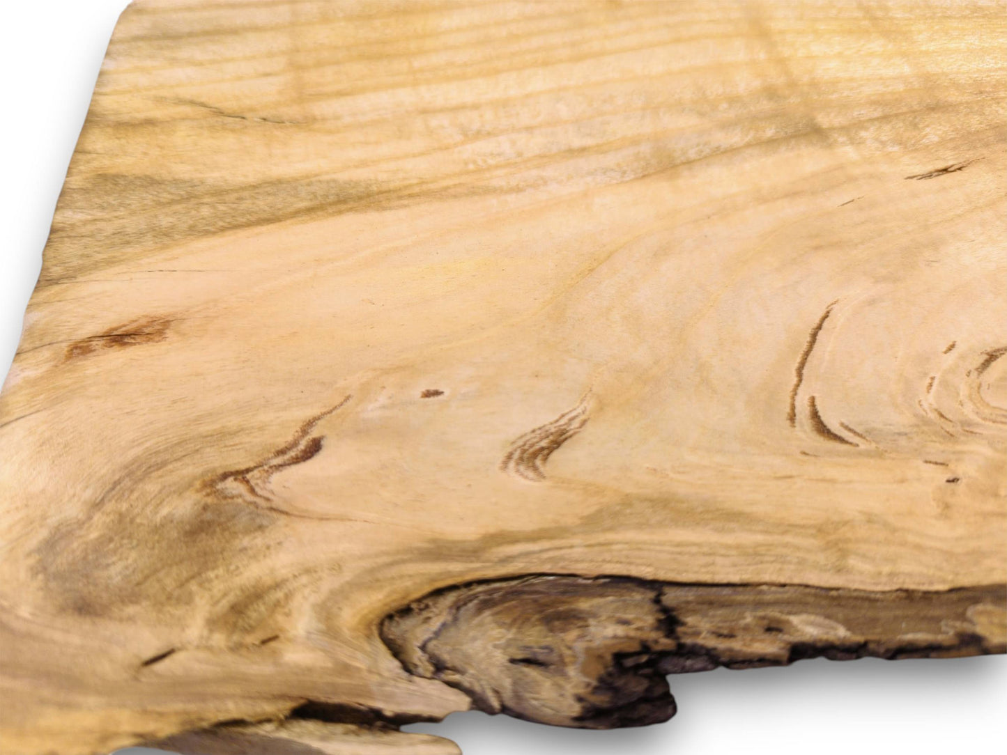 Extreme close-up on a slab's corner, with light wood grain swirling into its dark, textured knot.