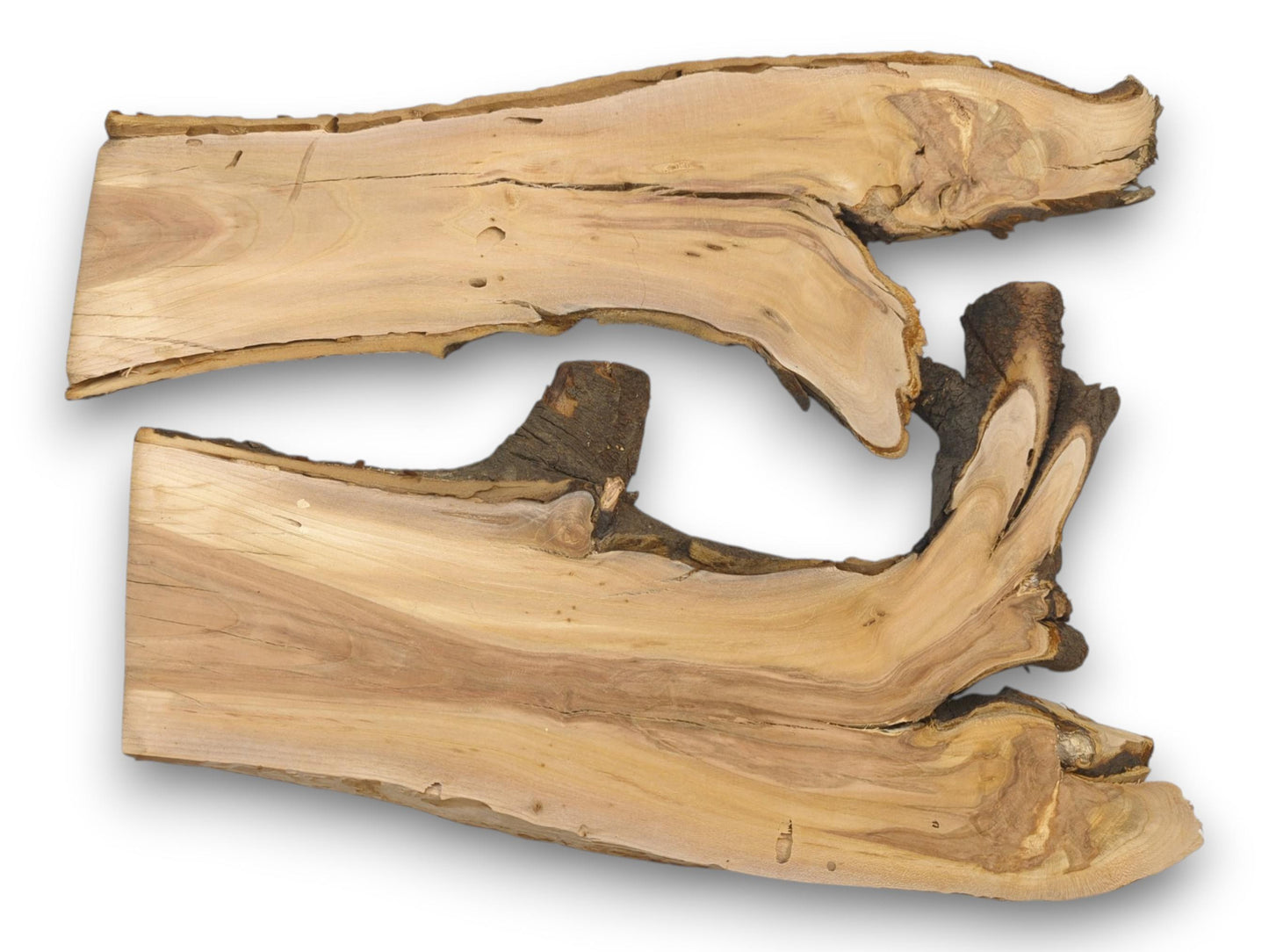 Top-down view of two wild cherry slabs featuring irregular live edges and prominent, swirling wood grain.