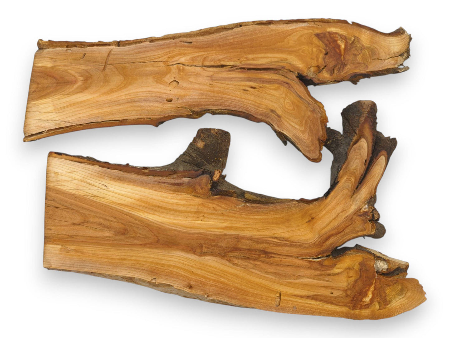 Two raw wild cherry wood slabs are arranged horizontally, highlighting their organic, bark-lined live edges.