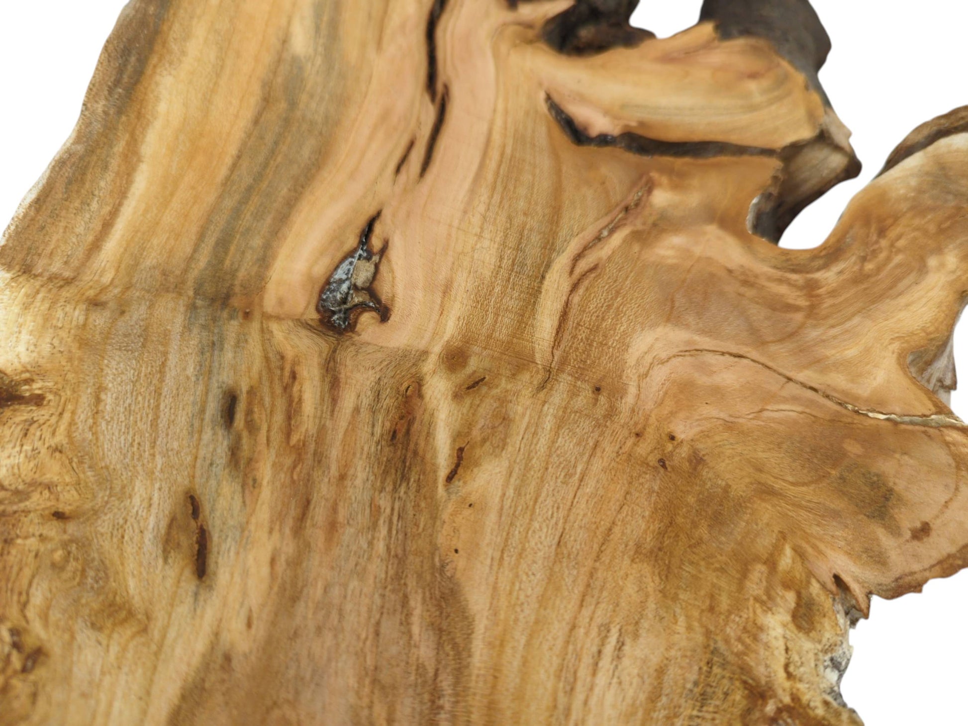 Overhead view of the slab's warm-toned surface with darker streaks and a single prominent wood knot.