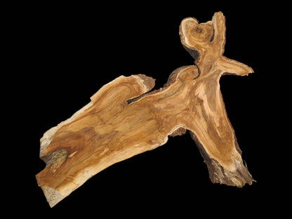 A full overhead view of an irregular wild cherry slab highlighting its distinctive shape and grain.