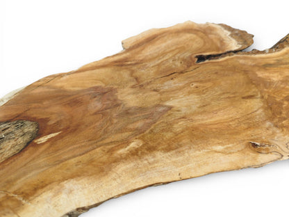 Detailed shot of a wild cherry wood surface with undulating grain, a dark knot, and cracks.