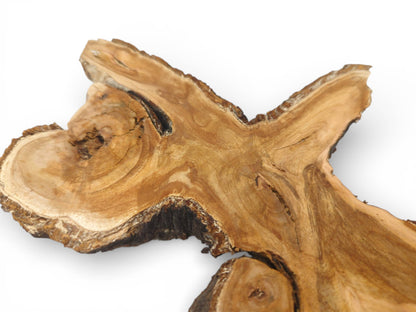 Angled close-up of a wild cherry crotch slab, showcasing the swirling grain and dark, natural edge.