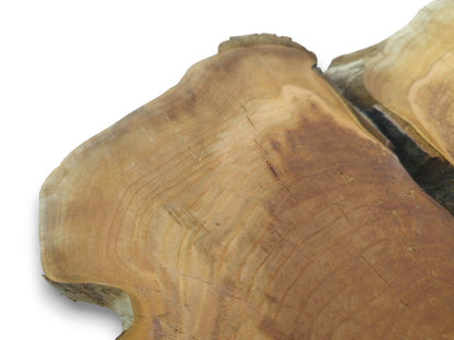 Close-up of a light brown cherry wood slab with natural edges and visible cracks.