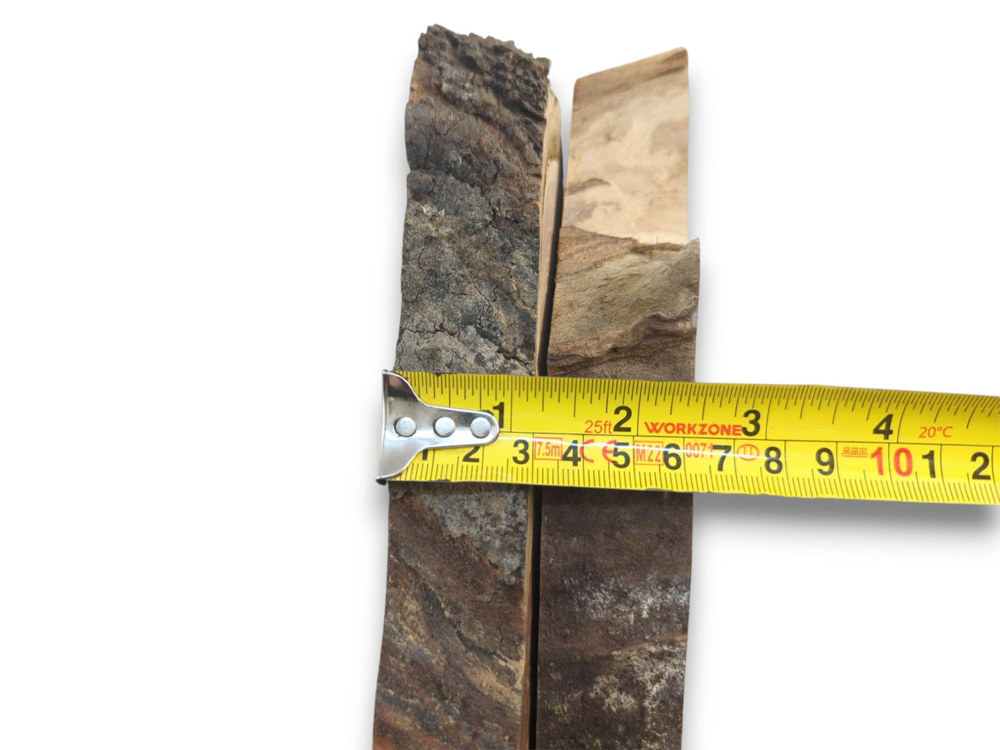 Two cherry wood slabs with natural bark edges, measured by a yellow tape on white background.