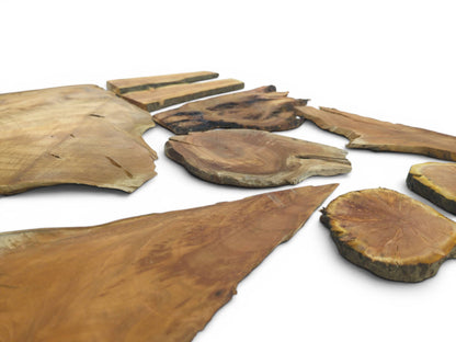 Multiple cherry wood pieces with live edges and visible grain, some planed and sanded.