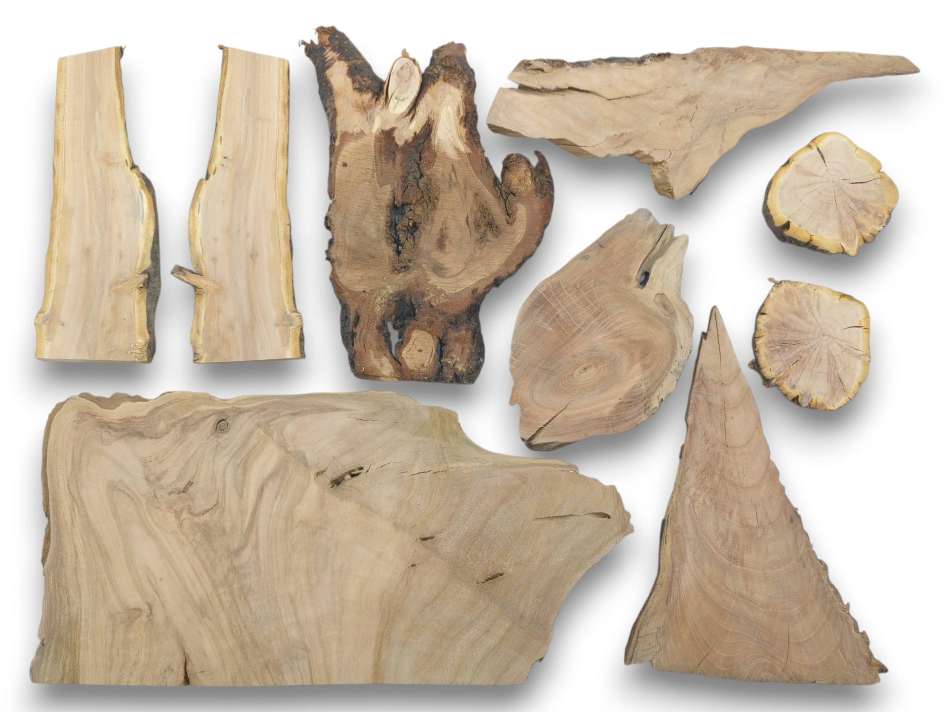 Overhead view of nine varied cherry wood pieces with live edges and visible grain.