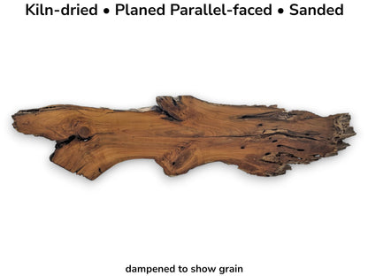 A long, kiln-dried, planed, and sanded cherry wood slab with natural live edges.