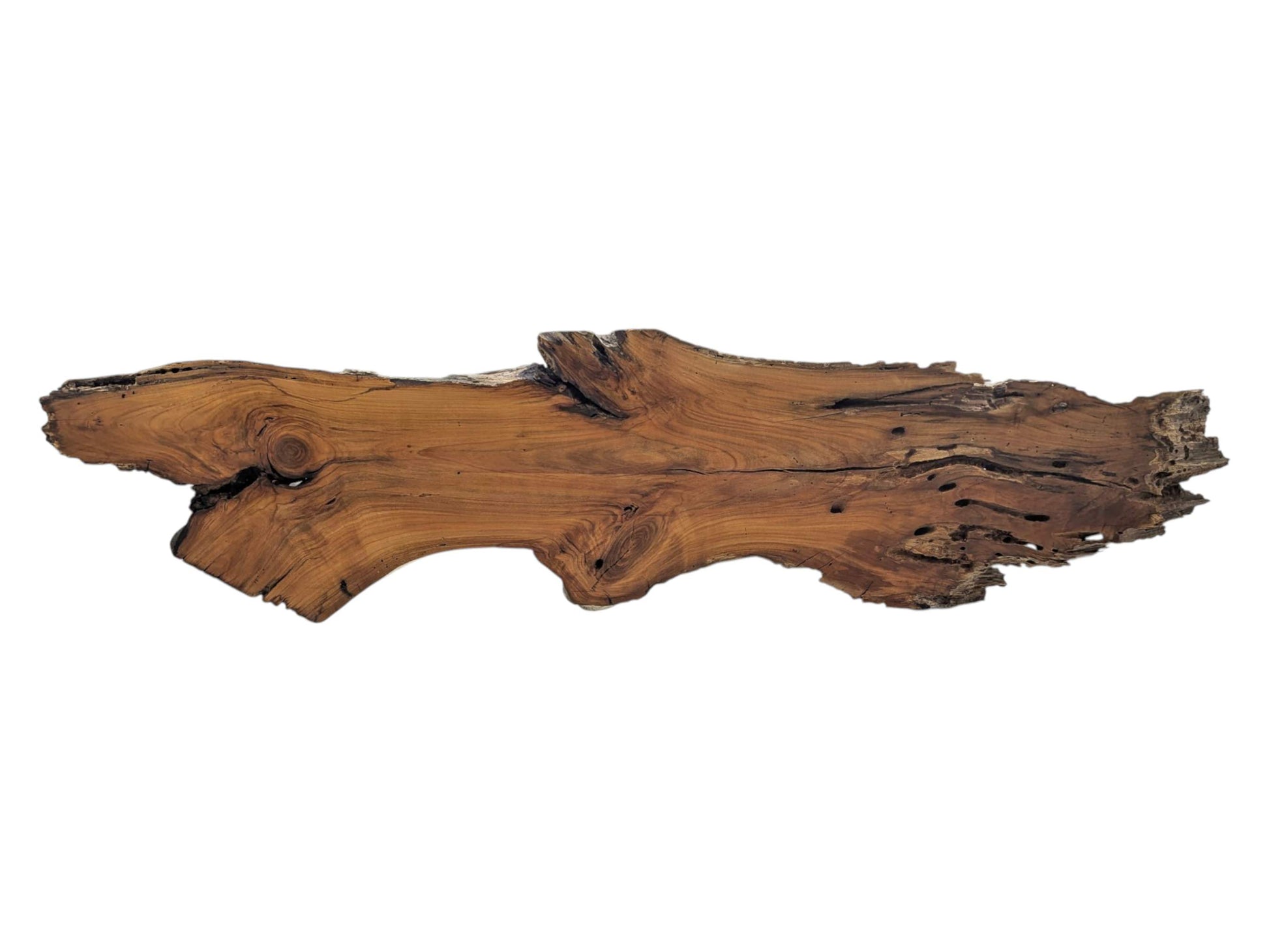 A long, live edge cherry wood slab with natural curves and visible knots.