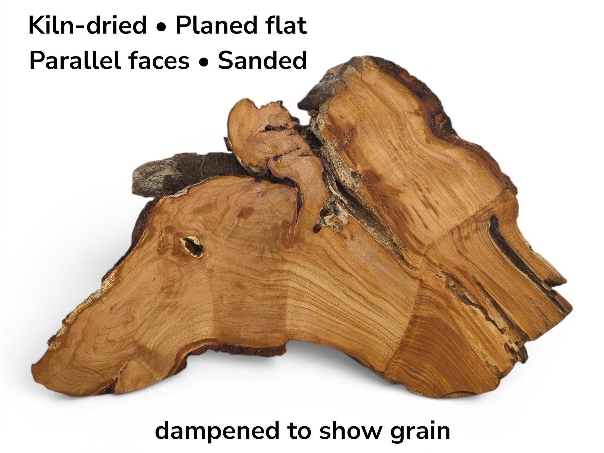 A kiln-dried, planed, and sanded wild cherry wood slab with parallel faces, dampened to show grain.