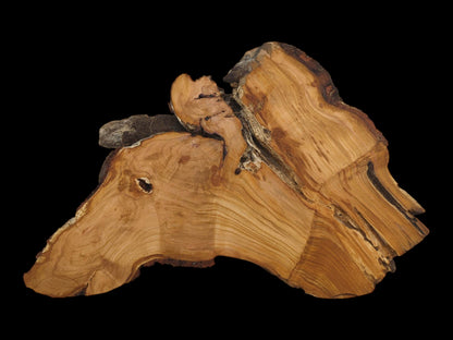 A single, untreated wild cherry wood slab with a live edge and visible grain.