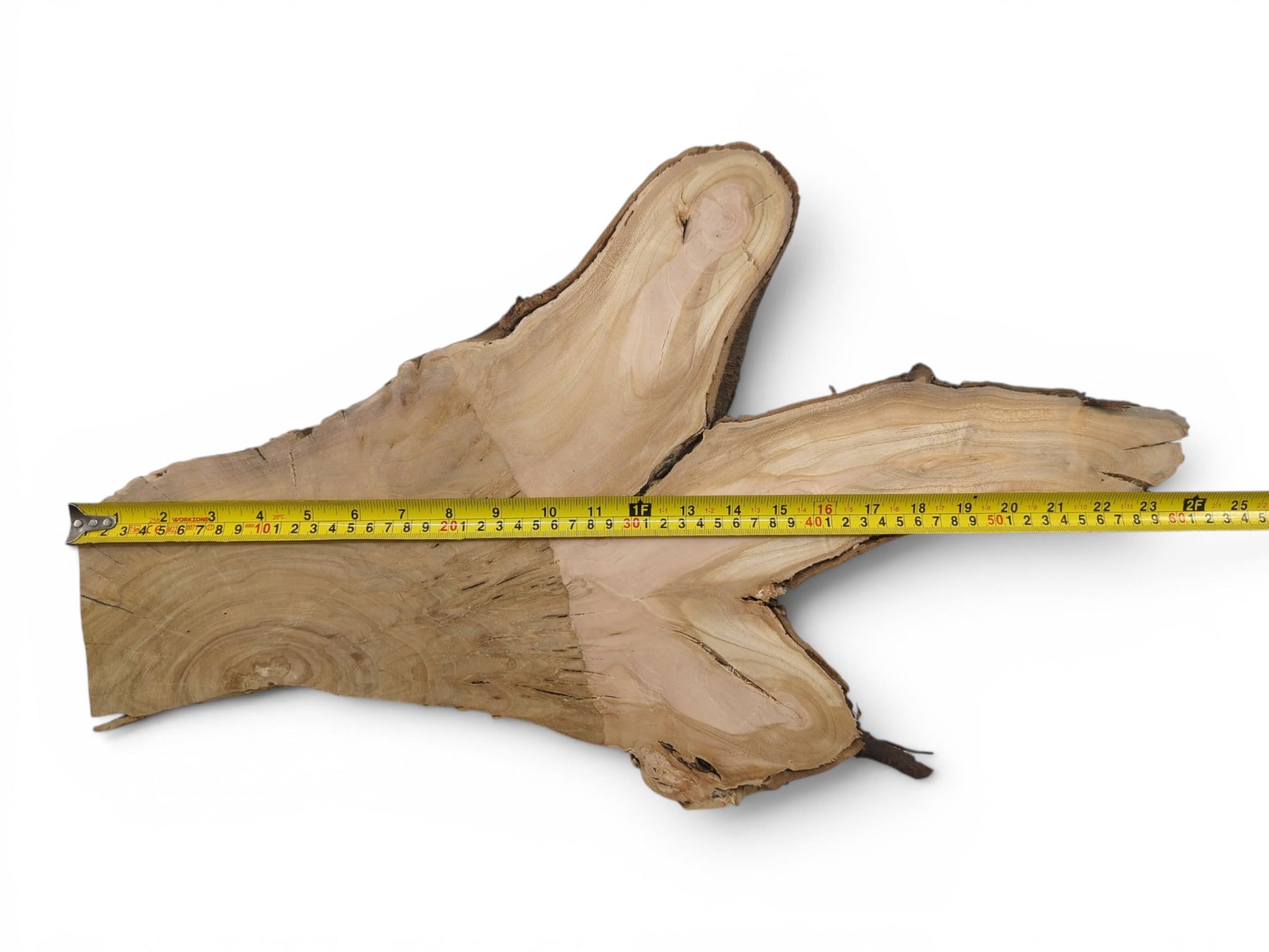 A light brown wild cherry wood slice with a natural live edge and prominent grain.