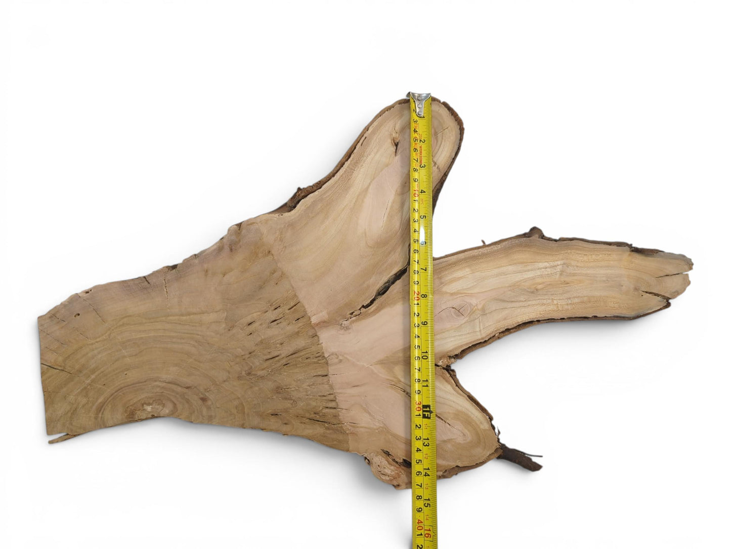 A light brown, irregularly shaped wild cherry wood slice with a natural live edge.