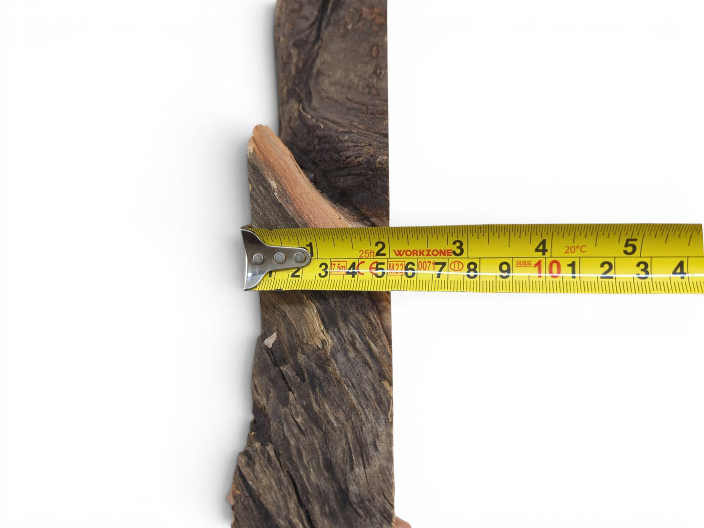 A close-up of a dark brown wild cherry wood slice with a natural live edge.