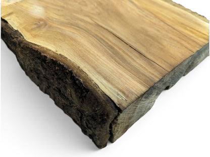 Close-up of a light brown wood slab with a live edge and natural bark.