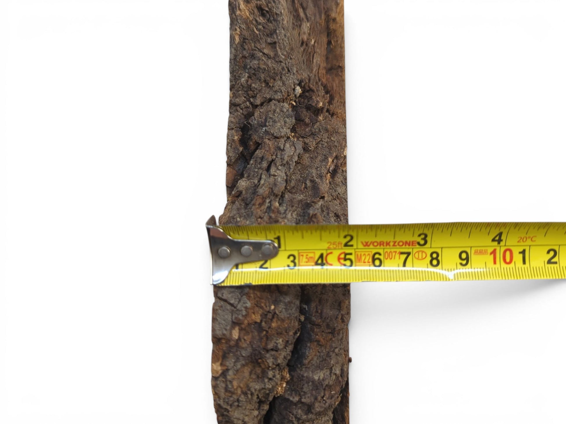 A wild cherry wood slab with a live edge and a yellow measuring tape across its width.