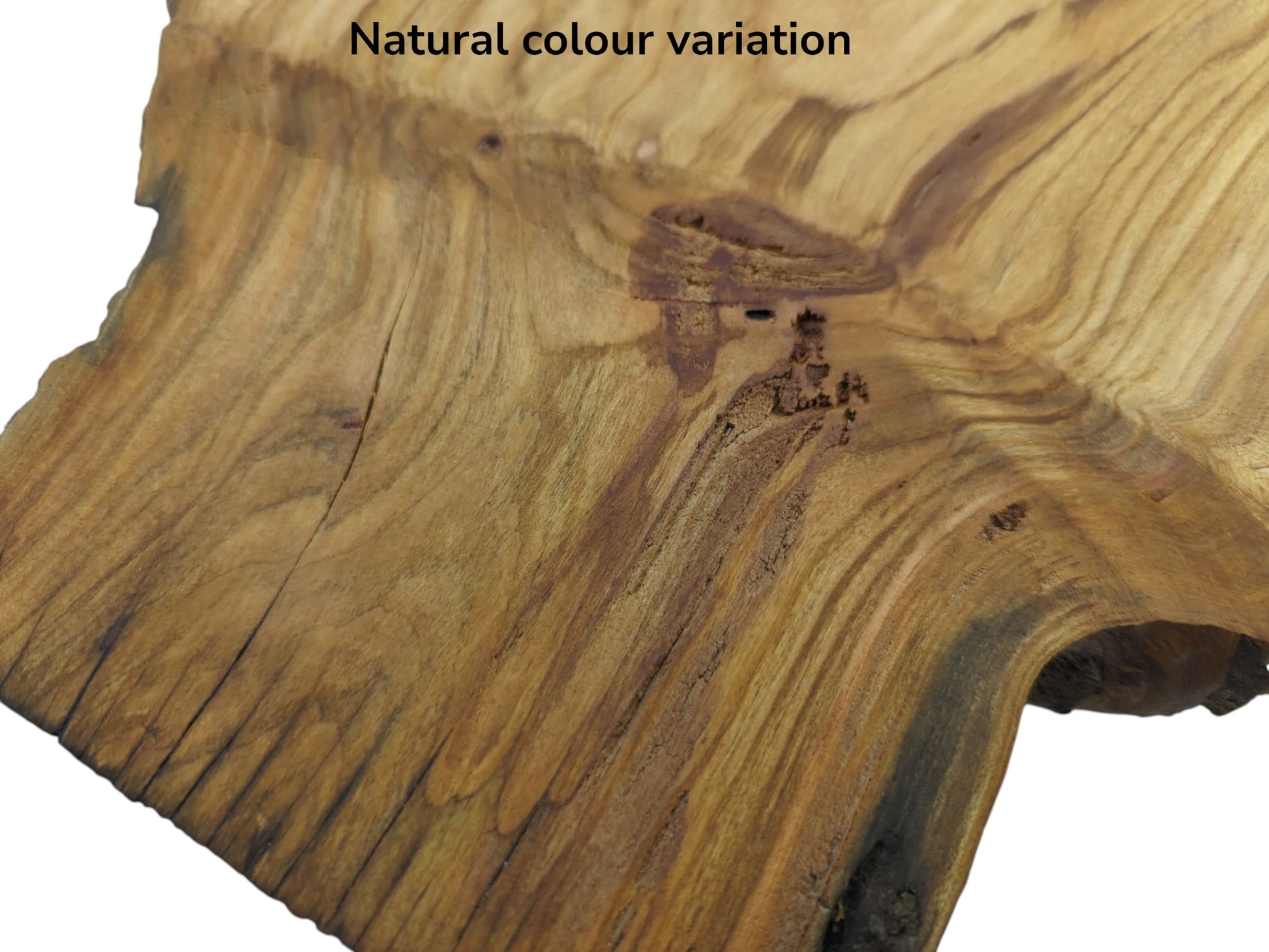 Close-up of a wild cherry wood slab showing natural color variation, grain, and cracks.