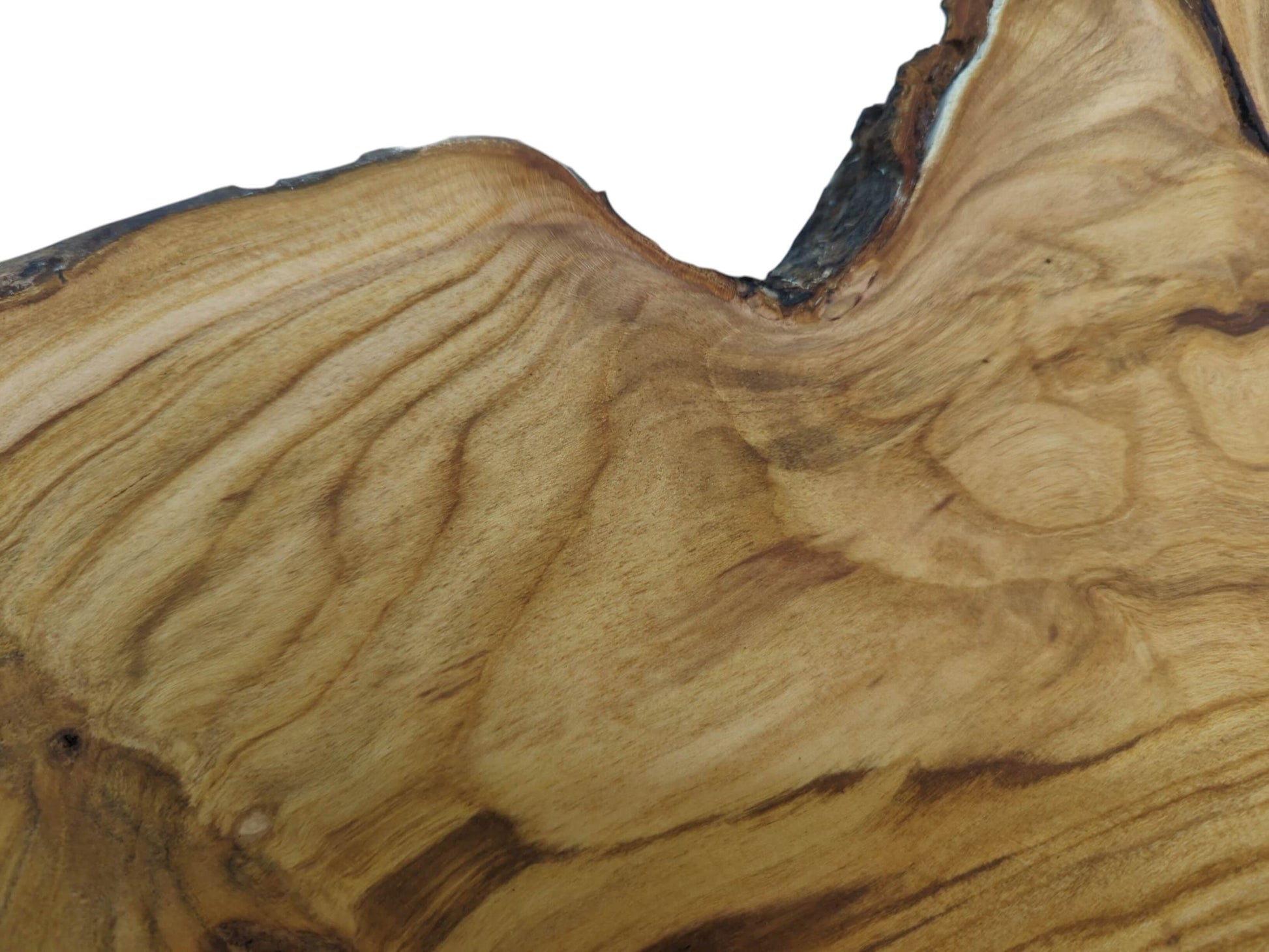 Close-up of a wild cherry wood slab with a smooth surface and natural, wavy grain patterns.