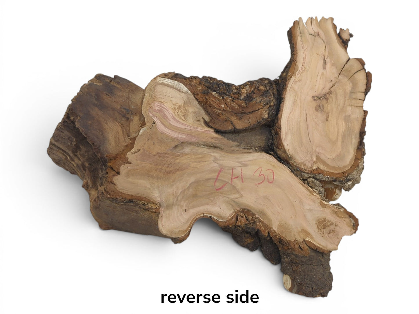 Reverse side of a wild cherry wood slab with natural bark edges and visible grain.