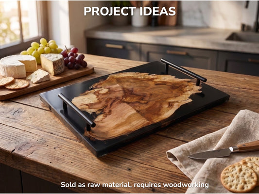 A wild cherry wood slab with live edge and black epoxy resin, used as a serving tray.