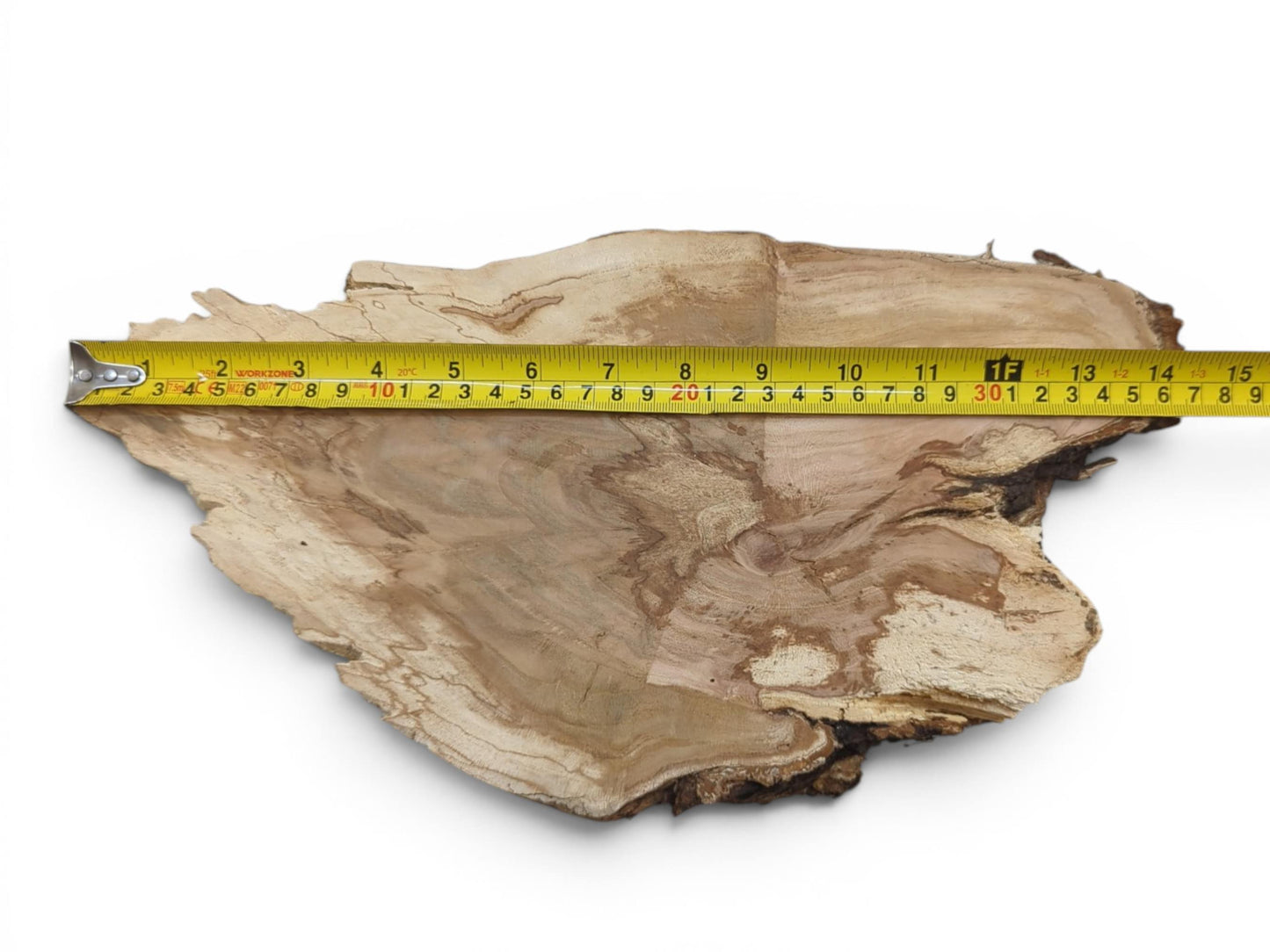 A wild cherry wood slab with a live edge, showing light and dark grain patterns.
