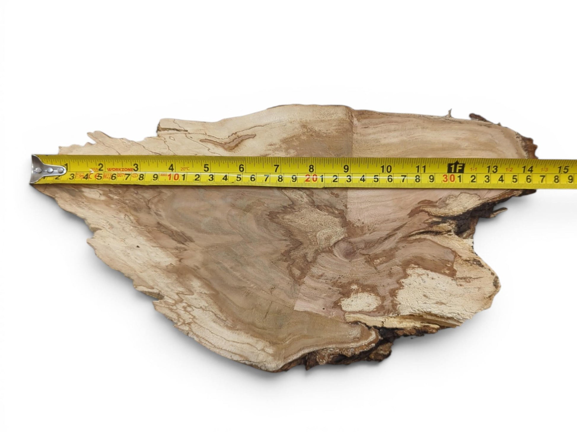 A wild cherry wood slab with a live edge, showing light and dark grain patterns.